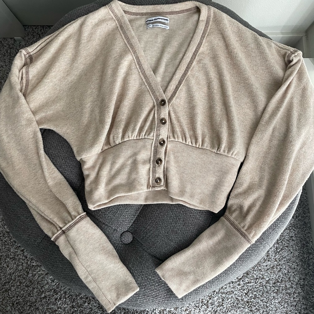 Tan crop top sweater.